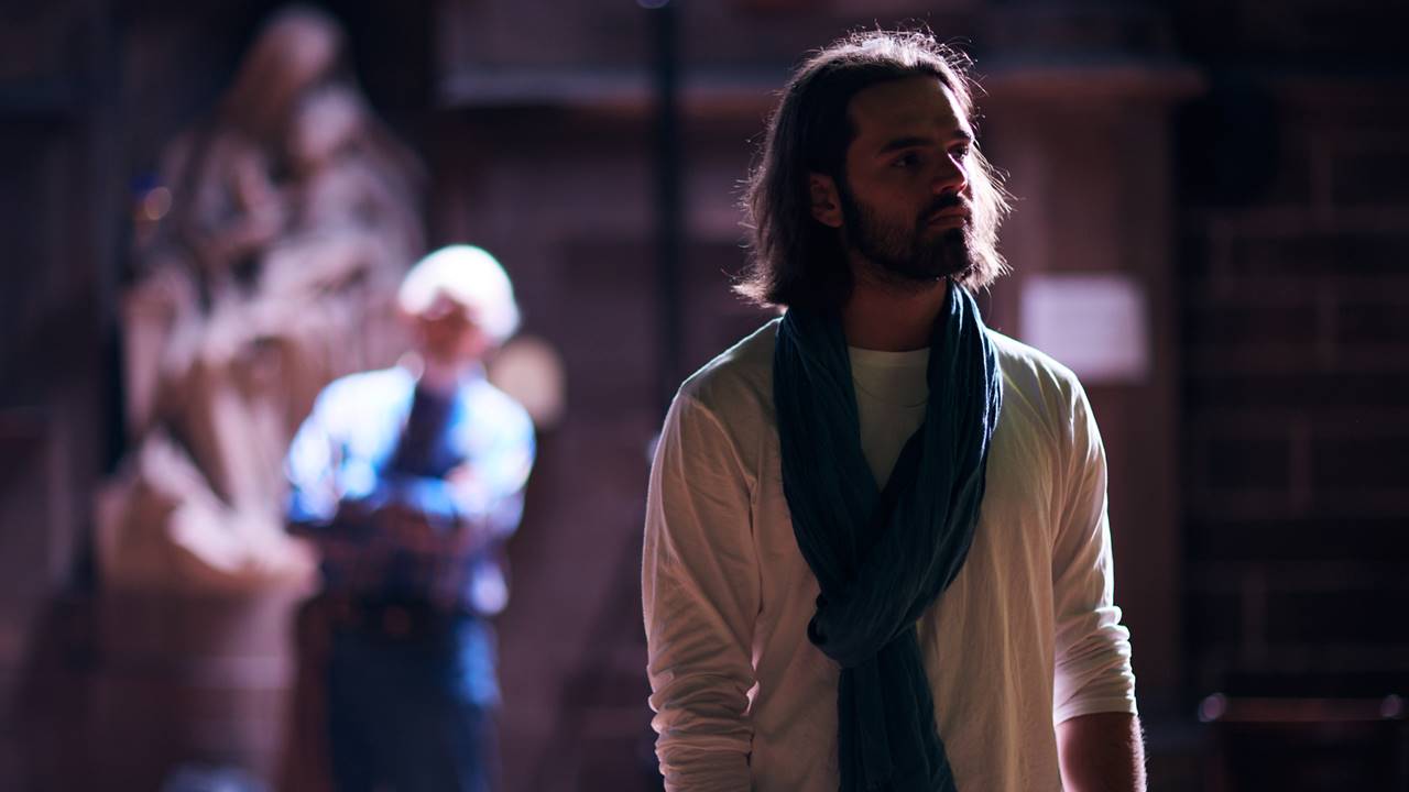 Jesus looking to the side with actors in background